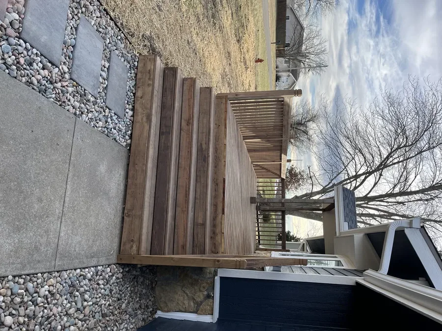 Wood deck surface installation by Kingdom Builders Co.