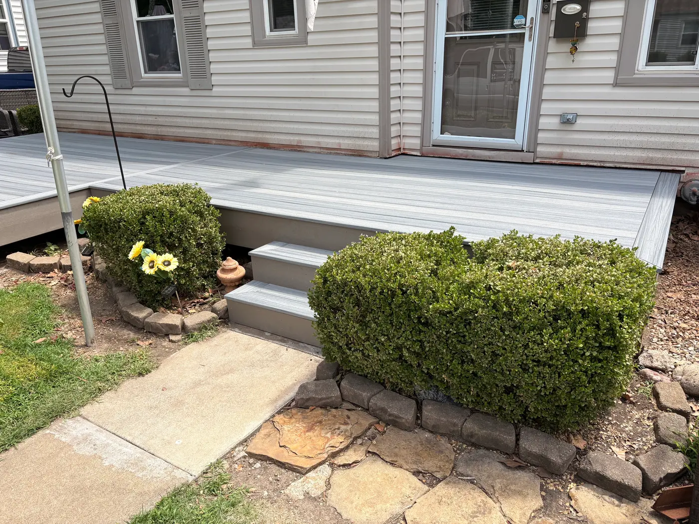 Composite deck steps leading to a back entry door in Topeka, KS
