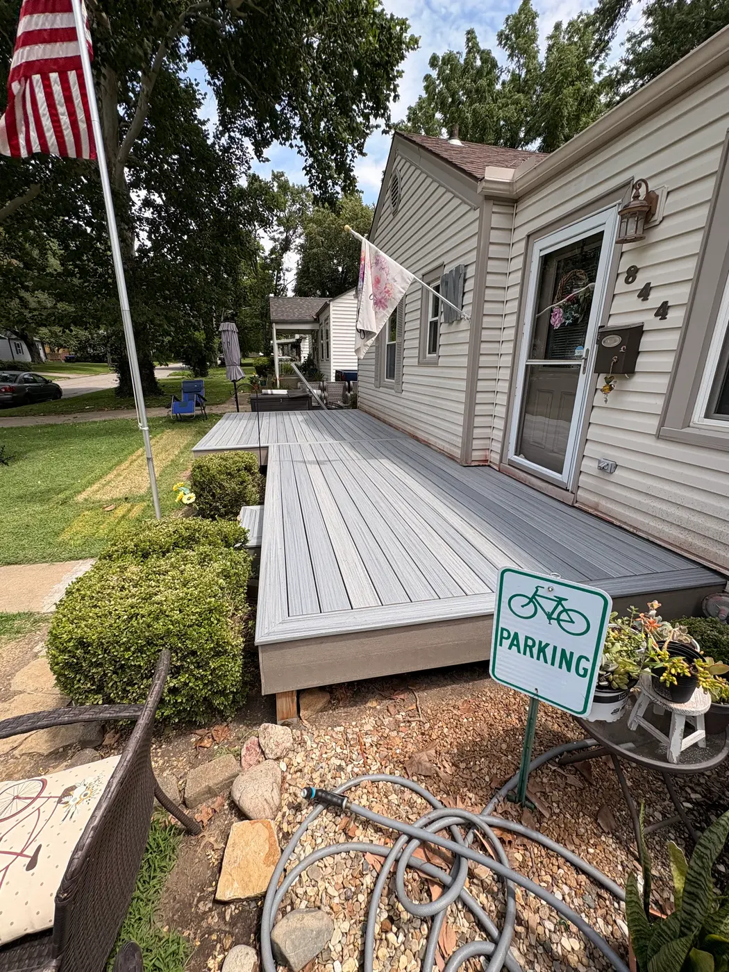 Composite deck installation wrapping along the side of a Topeka, KS home