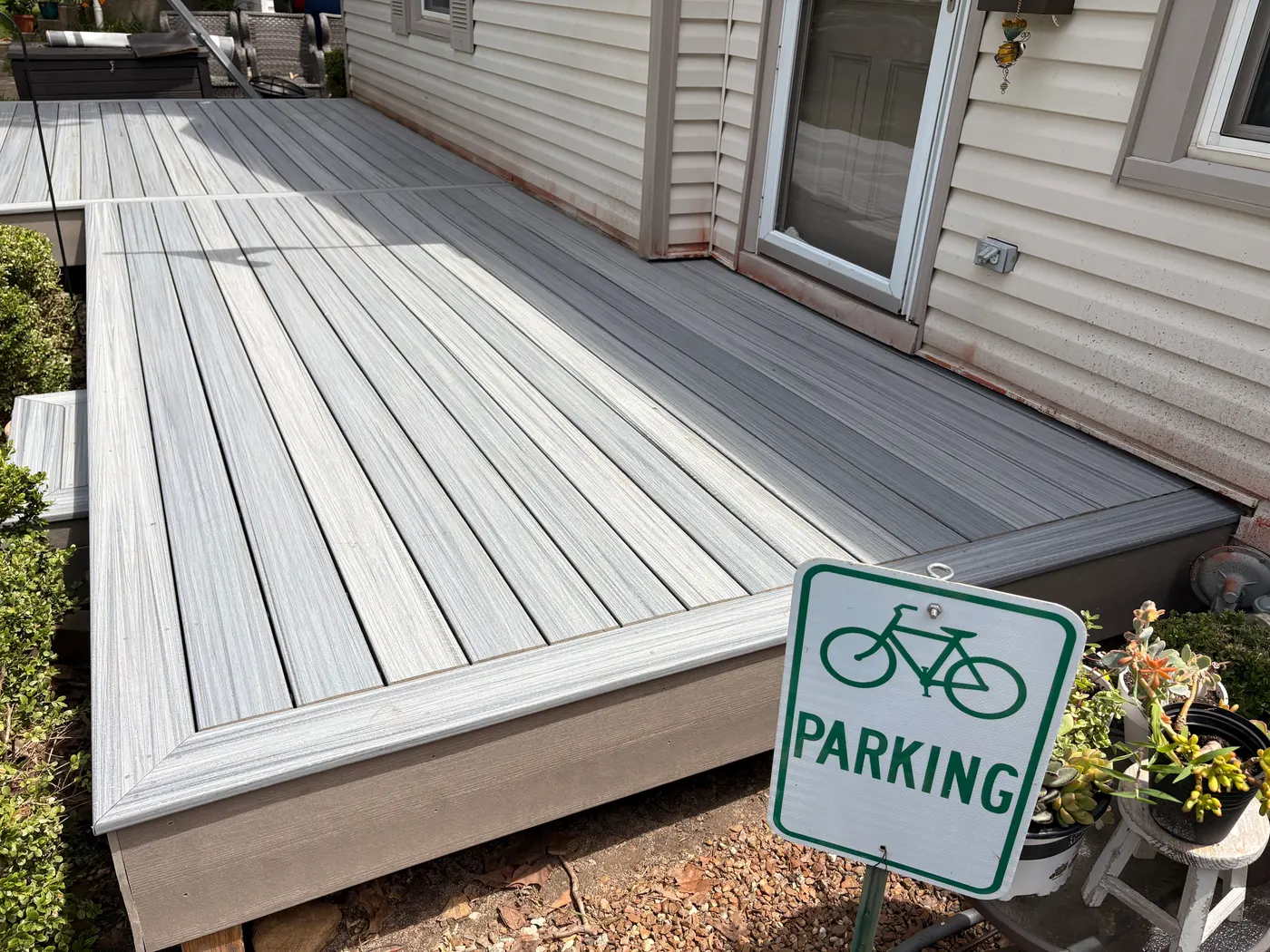 Grey composite deck boards with a screw-free surface in Topeka