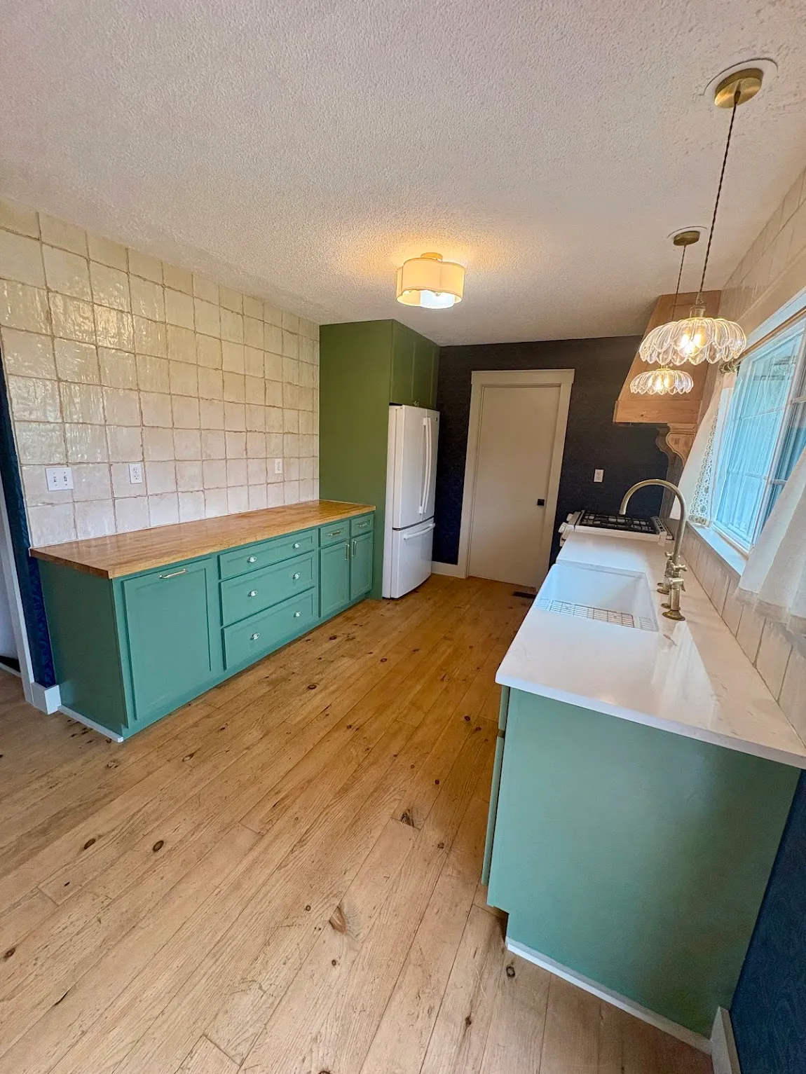 Cabinet refresh, Topeka KS Refinished green kitchen cabinets with butcher block counters in a Topeka, KS home
