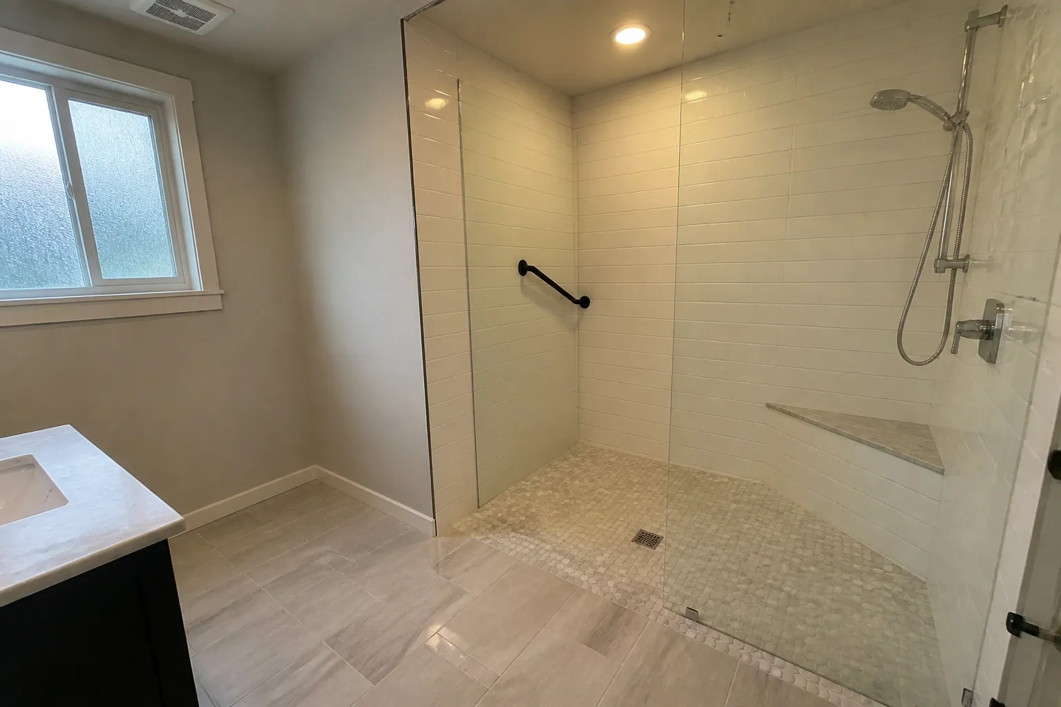Curbless shower entry example Curbless tiled shower entry example for an aging-in-place bathroom in Topeka, KS